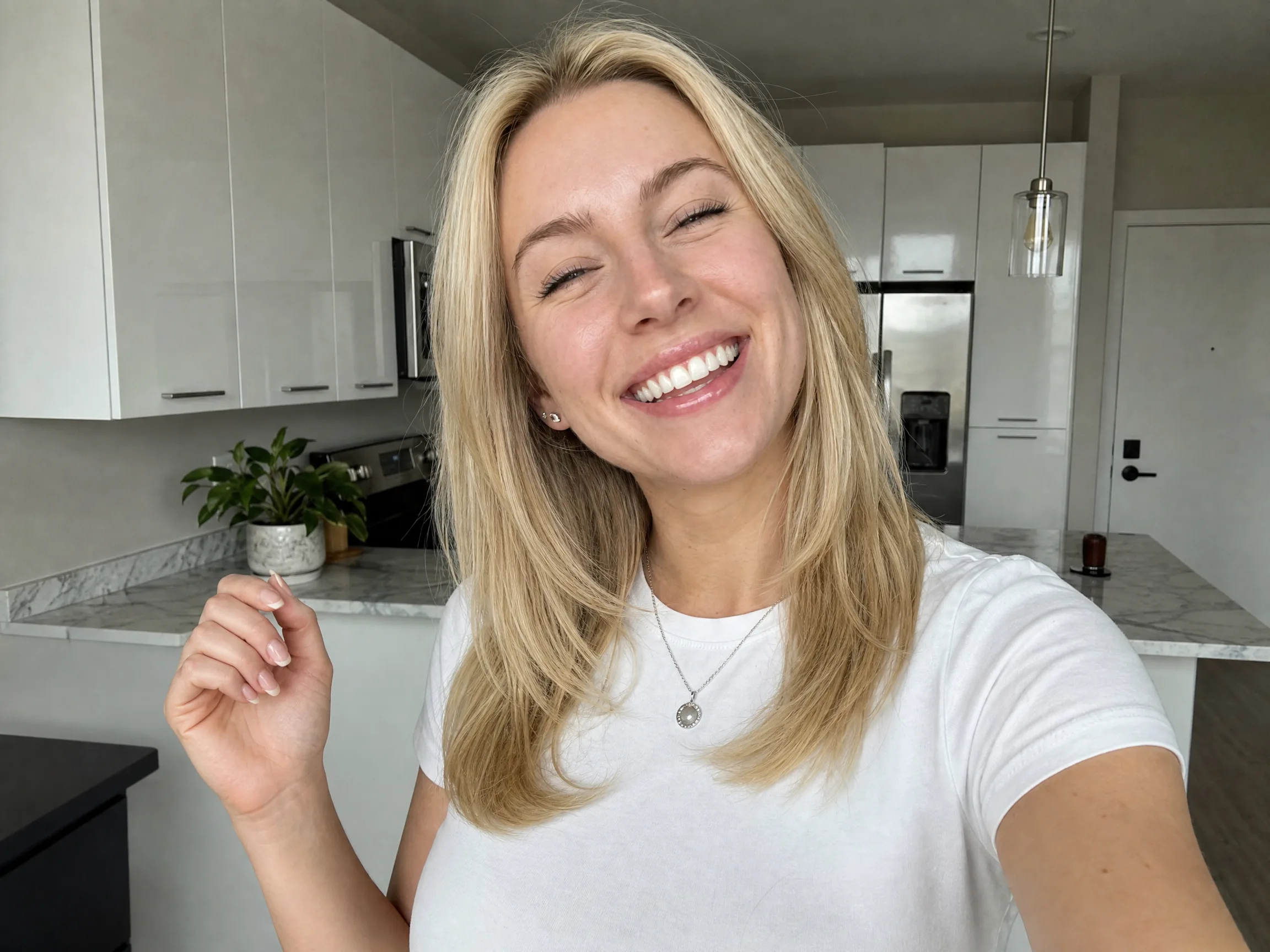 Daily vlog creator selfie in a bright kitchen